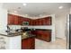 Open kitchen with stainless steel appliances, dark granite countertops, and ample cabinet space at 20121 N 76Th St # 2064, Scottsdale, AZ 85255