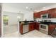 Modern kitchen with stainless steel appliances and breakfast bar adjacent to the living area at 20121 N 76Th St # 2064, Scottsdale, AZ 85255