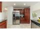 Spacious kitchen features stainless steel refrigerator and plenty of cabinet storage at 20121 N 76Th St # 2064, Scottsdale, AZ 85255