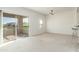 Bright living room features a glass slider with balcony access and opens to the kitchen at 20121 N 76Th St # 2064, Scottsdale, AZ 85255
