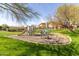 Fun playground area with slides and climbing structures, surrounded by lush greenery and a community park at 20121 N 76Th St # 2064, Scottsdale, AZ 85255