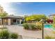 Community pool area featuring a hot tub, covered seating, and lush landscaping under a bright blue sky at 20121 N 76Th St # 2064, Scottsdale, AZ 85255