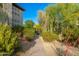 Community walkway lined with diverse desert landscaping, creating a tranquil path at 20121 N 76Th St # 2064, Scottsdale, AZ 85255