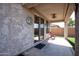 Covered patio area featuring stucco walls, concrete flooring, ceiling fan and a charming decorative sun at 20222 N 267Th Ln, Buckeye, AZ 85396