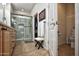 Bathroom featuring wood cabinets, a glass door shower, tile flooring, and a toilet at 20222 N 267Th Ln, Buckeye, AZ 85396
