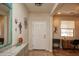 Inviting foyer with tile floor, decorated walls, and view into the living spaces at 20222 N 267Th Ln, Buckeye, AZ 85396