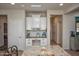 Granite island with white cabinets and drawers in a modern kitchen at 20222 N 267Th Ln, Buckeye, AZ 85396