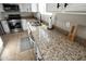 Kitchen with granite counters, stainless steel sink, and stainless steel appliances at 20222 N 267Th Ln, Buckeye, AZ 85396