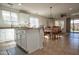 Open concept kitchen featuring granite countertops and bright lighting at 20222 N 267Th Ln, Buckeye, AZ 85396