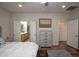 Comfortable main bedroom with ensuite bathroom featuring double sinks and glass shower at 20222 N 267Th Ln, Buckeye, AZ 85396