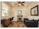 Cozy office features a stone fireplace and a comfortable sofa at 20222 N 267Th Ln, Buckeye, AZ 85396
