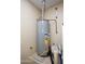 Water heater in utility space with copper pipes, vents, and electrical connections at 20222 N 267Th Ln, Buckeye, AZ 85396