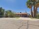 Street view of home featuring a car port, desert landscaping, and two large palm trees at 2049 W Joan De Arc Ave, Phoenix, AZ 85029