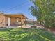 Spacious backyard featuring a covered patio, fenced-in pool area, and a built-in fire pit at 2049 W Joan De Arc Ave, Phoenix, AZ 85029