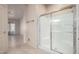 This bathroom features a glass door shower and tiled floors at 2101 S Meridian Rd # 26, Apache Junction, AZ 85120
