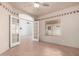 Bedroom featuring a ceiling fan, arched doorway, and tiled floors at 2101 S Meridian Rd # 26, Apache Junction, AZ 85120
