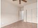 This well-lit bedroom has tiled floors and a double door closet at 2101 S Meridian Rd # 26, Apache Junction, AZ 85120