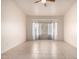 Bedroom featuring neutral walls, tiled floors, and a bay window at 2101 S Meridian Rd # 26, Apache Junction, AZ 85120