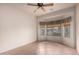 A bright bedroom features tiled floors, ceiling fan, and a bay window at 2101 S Meridian Rd # 26, Apache Junction, AZ 85120
