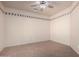 Bedroom with ceiling fan, tiled floors, and a neutral color scheme at 2101 S Meridian Rd # 26, Apache Junction, AZ 85120