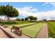 Well-maintained bocce ball court with lush surroundings, perfect for friendly competition and outdoor fun at 2101 S Meridian Rd # 26, Apache Junction, AZ 85120