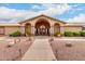 Inviting clubhouse entrance with landscaped grounds, covered walkway, and ample parking, a community hub at 2101 S Meridian Rd # 26, Apache Junction, AZ 85120