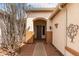 Inviting entryway with an arched portico and desert landscaping at 2101 S Meridian Rd # 26, Apache Junction, AZ 85120