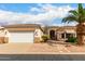 Inviting single-story home with a two-car garage and desert landscaping at 2101 S Meridian Rd # 26, Apache Junction, AZ 85120