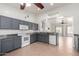 Modern kitchen with gray cabinets, granite countertops, and appliances, connecting to the living room at 2101 S Meridian Rd # 26, Apache Junction, AZ 85120