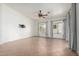 Spacious living room with tile flooring, ceiling fan, and large windows at 2101 S Meridian Rd # 26, Apache Junction, AZ 85120