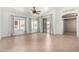 Spacious living room with tile flooring, ceiling fan, and large windows at 2101 S Meridian Rd # 26, Apache Junction, AZ 85120
