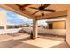 An outdoor patio with a ceiling fan overlooks a rock garden at 2101 S Meridian Rd # 26, Apache Junction, AZ 85120