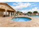 Inviting pool area with a jacuzzi, lounge chairs, and landscaped surroundings for a refreshing and relaxing experience at 2101 S Meridian Rd # 26, Apache Junction, AZ 85120