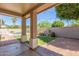 Relaxing backyard featuring a covered patio, pool with safety fence, and a calming water feature at 21313 N 59Th Dr, Glendale, AZ 85308