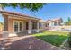 Backyard featuring a covered patio, pool with fence, and a well-maintained lawn at 21313 N 59Th Dr, Glendale, AZ 85308