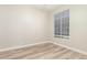 Bedroom with vinyl flooring, a neutral paint and window with blind at 21313 N 59Th Dr, Glendale, AZ 85308