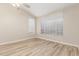 Bedroom featuring neutral-toned walls, carpet floors, and a large window at 21313 N 59Th Dr, Glendale, AZ 85308