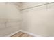 Walk-in closet with metal racks and vinyl flooring at 21313 N 59Th Dr, Glendale, AZ 85308