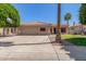 Single-Gathering home with attached two-car garage, concrete driveway, and desert landscaping at 21313 N 59Th Dr, Glendale, AZ 85308