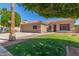 Charming single-Gathering home with manicured lawn, desert landscaping, and a two-car garage at 21313 N 59Th Dr, Glendale, AZ 85308