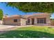 Single-Gathering home with manicured lawn, desert landscaping, and a two-car garage at 21313 N 59Th Dr, Glendale, AZ 85308