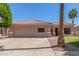 Single-Gathering home with attached two-car garage, concrete driveway, and desert landscaping at 21313 N 59Th Dr, Glendale, AZ 85308