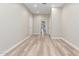 Spacious living room with wood-look floors and neutral walls at 21313 N 59Th Dr, Glendale, AZ 85308
