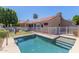 Backyard pool with white fence and view of single story house with red tile roof at 21313 N 59Th Dr, Glendale, AZ 85308