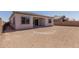 The backyard has fresh dirt with a covered patio, ready for landscaping and outdoor enjoyment at 21846 E Bonanza Ct, Queen Creek, AZ 85142