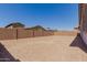 Expansive backyard surrounded by a brick privacy wall, offering endless potential for outdoor living at 21846 E Bonanza Ct, Queen Creek, AZ 85142