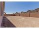 Large backyard featuring fresh dirt and privacy wall at 21846 E Bonanza Ct, Queen Creek, AZ 85142