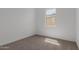 Bright bedroom featuring neutral carpet, a window that provides natural light at 21846 E Bonanza Ct, Queen Creek, AZ 85142