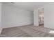 Bright bedroom with neutral carpet and ensuite bathroom access for added convenience at 21846 E Bonanza Ct, Queen Creek, AZ 85142