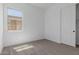 Bright bedroom featuring neutral carpet, a window, and a closet at 21846 E Bonanza Ct, Queen Creek, AZ 85142